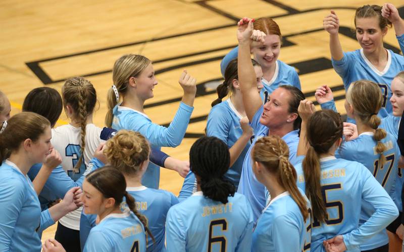 Members of the Marquette volleyball team huddle with head coach Mindy McConnaughhay between sets while playing  Putnam County on Thursday, Sept 7, 2023 at Putnam County High School.