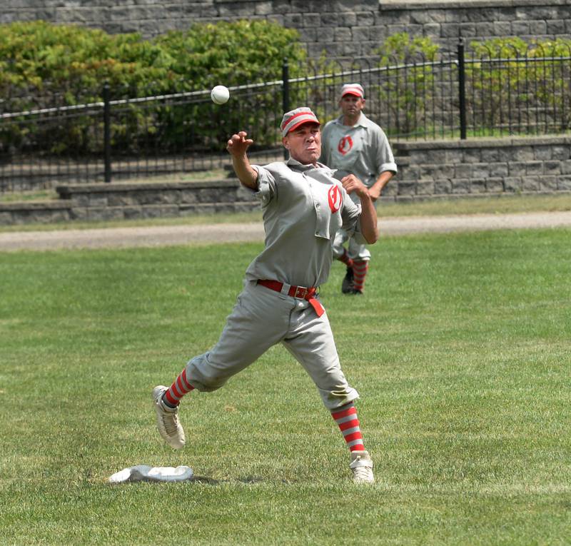 Oregon Ganymede second baseman Bill Roschi throws to first for a double play against the Bay City Independents during the World Tournament of Historic Base Ball held at the Henry Ford Museum's Greenfield Village on Saturday, Aug. 9, 2025.