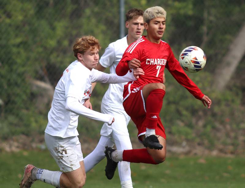 Dundee-Crown’s Hugo Arista, right, moves past  St. Charles East’s Carter Newell in IHSA Class 3A Regional Championship soccer at Dundee-Crown High School in Carpentersville on Saturday, October 25, 2025.