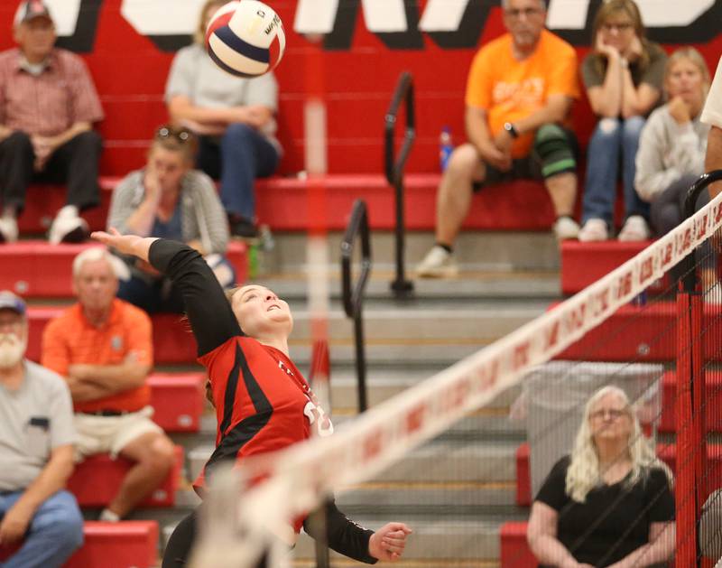 Earlville's Mady Olaon spikes the ball to the Somonauk side of the net