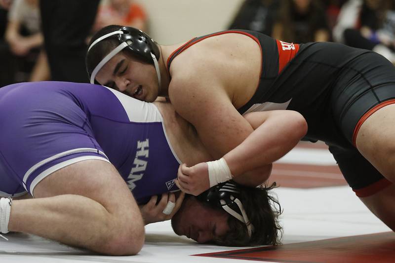Huntley’s Markos Mihalopolus tries to control  Hampshire's Joseph Ochoa during the 285-pound match of a Fox Valley Conference wrestling match Wednesday, Jan. 24, 2024, at Huntley High School.