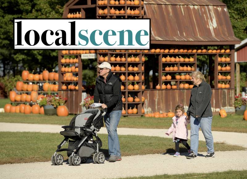 Shaw Local file photo – Mark and Lisa Lockett of Downers Grove take their granddaughter Lexie Ruschke apple picking at the Jonamac Orchard in Malta on Wednesday, Sept. 28, 2022. Local Scene for DeKalb County, week of Oct. 19, 2023