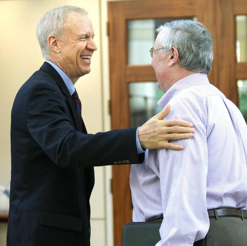 Gov. Bruce Rauner and DeKalb Mayor Jerry Smith share a laugh Tuesday at the Barsema Alumni and Visitors Center at Northern Illinois University, prior to the announcement of NIU's involvement in the Illinois Innovation Network in partnership with the University of Illinois system. The Illinois Innovation Network brings together community leaders, innovation-minded groups, enterprises, and educational institutions on a common platform where they can connect with each other to further innovation and economic growth in Illinois.