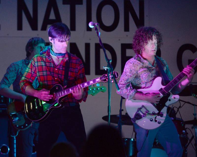 Two members of Fortunate Sons, a Creedence Clearwater tribute band, play their guitars during the Jamboree Concert Series in Mt. Morris on Friday, Aug, 29, 2025.