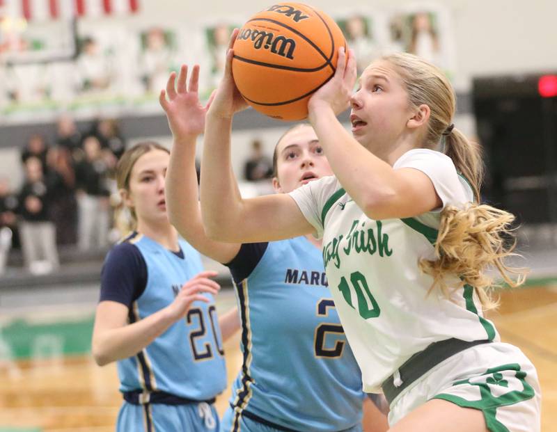 Seneca's Graysen Provance eyes the hoop after getting by Marquette's Kinley Rick in the lane on Thursday, Feb. 5, 2026 at Seneca High School.