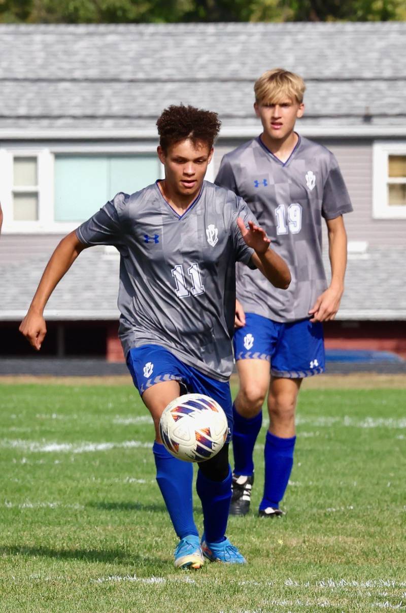 Princeton's Levi Boggs pushes the ball up in Saturday's regional quarterfinal soccer match vs. Stanford Olympia at Bryant Field. The Tigers won 6-2.