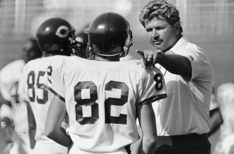 Chicago Bears head coach Mike Ditka talks with wide receiver Ken Margerum during training camp on Wednesday, June 12, 1985 in Platteville Wis.