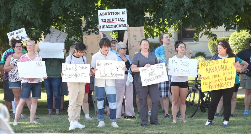 Protesters line State Street in Sycamore Friday, June 24, 2022, during a rally for abortion rights in front of the DeKalb County Courthouse in Sycamore. The group was protesting Friday's decision by the Supreme Court to overturn Roe v. Wade, ending constitutional protections for abortion.