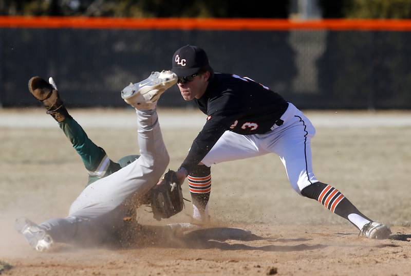 Crystal Lake Central's James Dreher tags out Boylan's Sonny Jass as he tries to steal second base during a nonconference baseball game Wednesday, March 29, 2023, at Crystal Lake Central High School.