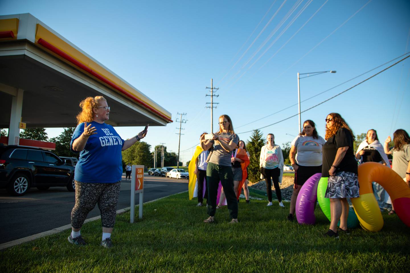 Organizer, Terri Helfers of Geneva speaks to the crowd that attended the Pride Fire Hydrant Rally at the northwest corner of Kirk Road and State Street/Rte. 38 in Geneva on Tuesday, Aug. 9, 2022.