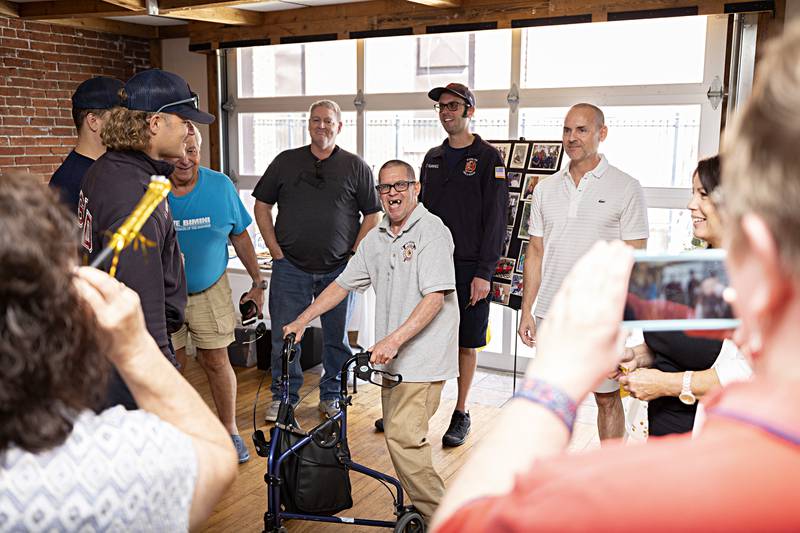 Merlin Kropf smiles as friends take pictures and celebrate his 70th birthday Sunday, Sept. 17, 2023. Known town wide, Kropf was often seen running around the city where he’d visit local businesses and his favorite, the Sterling Fire Department.