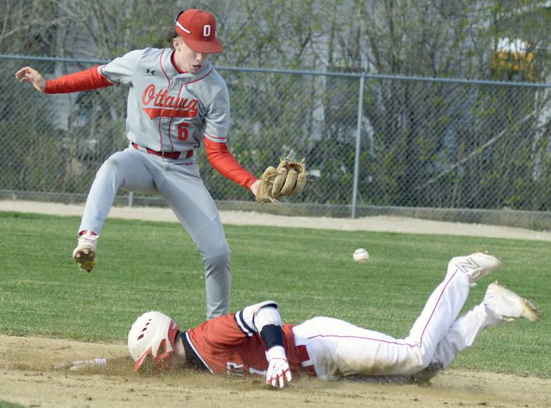 Ottawa’s Colin Fowler reaches for a wide throw as Streator’s Isaiah Weibel gets safely to the second base bag Thursday, April 3, 2025, at Streator's SHS Athletic Fields.
