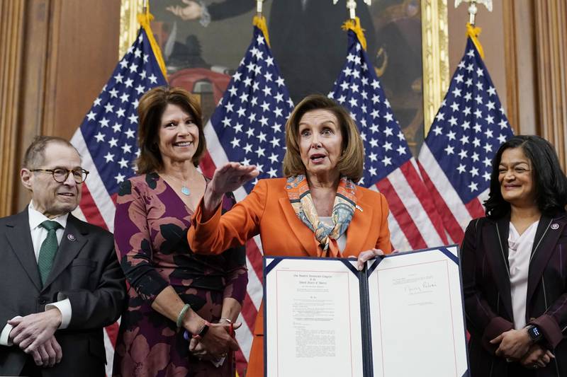 House Speaker Nancy Pelosi of Calif., center, speaks as she holds up a copy of H.R. 4445, the Ending Forced Arbitration of Sexual Assault and Sexual Harassment Act of 2021, during a bill enrollment ceremony on Capitol Hill in Washington in early March. Pelosi is with, from left, Rep. Jerrold Nadler, D-N.Y., Rep. Cheri Bustos, D-Ill., and Rep. Pramila Jayapal, D-Wash.