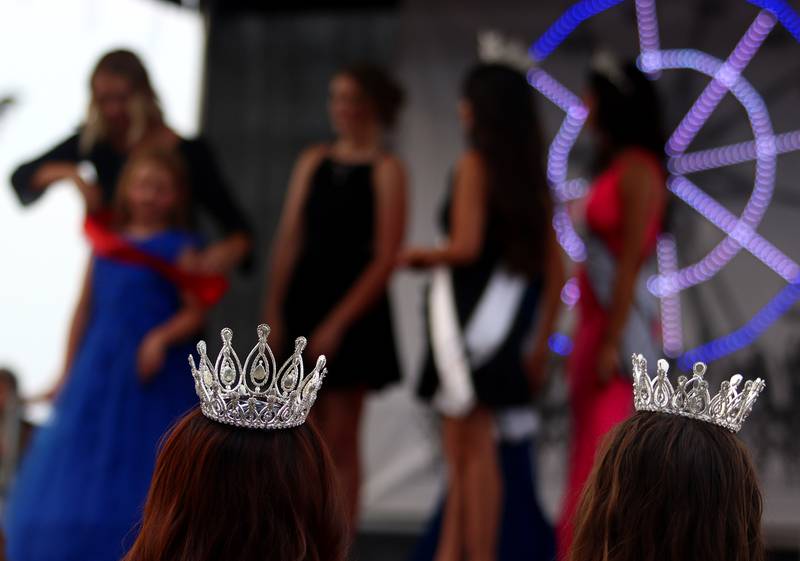 Reigning queens in the audience watch the Miss McHenry County Pageant at the McHenry County Fair in Woodstock on Tuesday, July 30, 2024.