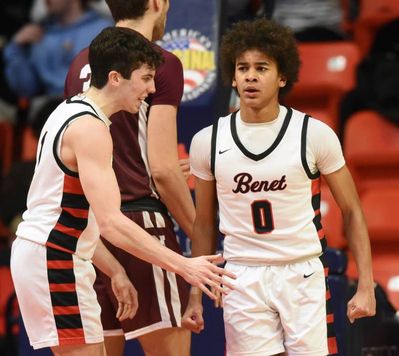Joe Lewnard/jlewnard@dailyherald.com
Benet Academy's Brayden Fagbemi, right, celebrates with teammate Sam Driscoll after drawing a foul on a basket during the Class 4A boys basketball state championship at State Farm Center in Champaign Saturday.