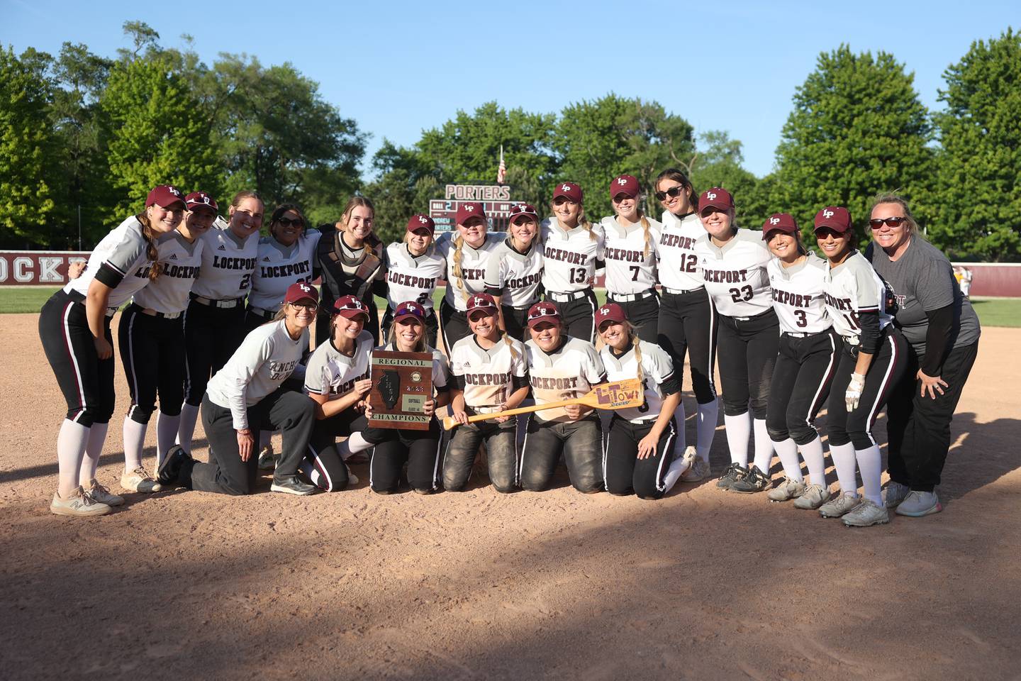 Lockport players pose with the championship plaque after a 4-1 win over Andrew in the Class 4A Lockport Regional Championship on Friday, May 26, 2023, in Lockport.