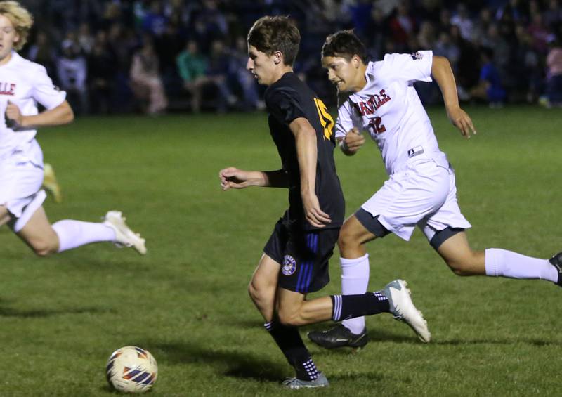 Somonauk's Luke Rader pushes the ball down the field as Earlville's Grady Harp runs beside in the Little Ten Conference championship game on Thursday, Oct. 5,  2023 at Hinckley High School.