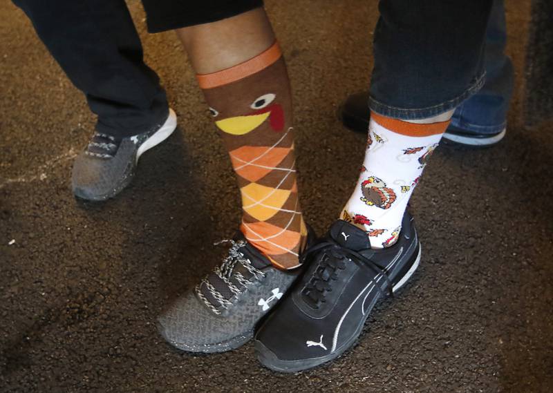 Turkey socks are showed off on Wednesday afternoon, Nov. 22, 2023, during the 41st annual Turkey Testicle Festival at Parkside Pub, in Huntley. The pre-Thanksgiving festival featured live music, beer, and lots of deep-fried turkey testicles.