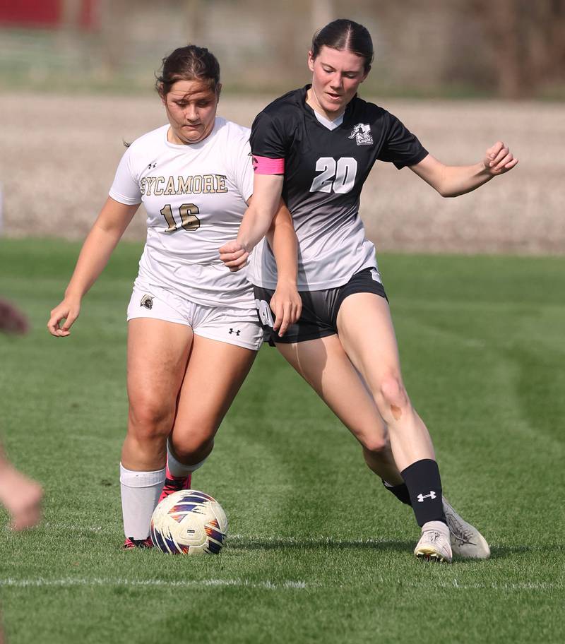 Sycamore's Charlotte Yates and Kaneland's Erin Doucette battle for possession during their game Monday, April 13, 2026, at Kaneland High School.
