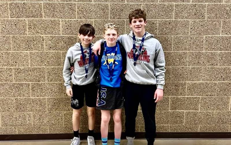 Princeton Logan Junior High School's  Jacob Paull (left), Hawk Amy and Brennen Emmett qualified for the IESA State Wrestling Tournament at the Convocational Center in DeKalb