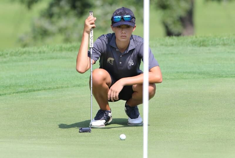 Sycamore’s Matthew Loos lines up his putt on the eighteenth green during the Mark Rolfing Cup Monday, Aug. 21, 2023, at the Kishwaukee Country Club in DeKalb.