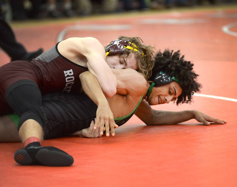 Rock Falls’ Adan Oquendo (bottom) battles Rockridge’s Clayton Blumenstein as they wrestle at 126-pounds at the 1A Oregon Sectional on Saturday, Feb. 15, 2025.