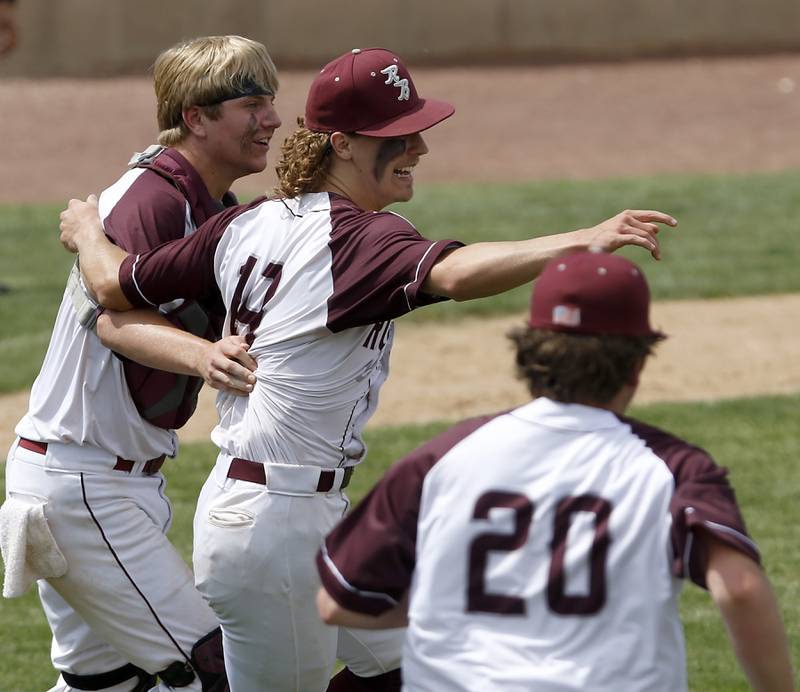 Richmond-Burton’s Hayden Christianson, Joseph Mrowiec and Alex Davis celebrate their win during a IHSA Class 2A supersectional baseball game against Timothy Christian at the Rockford Rivets Stadium in Rockford.
