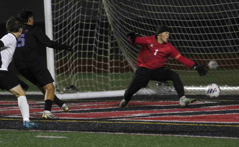 St. Charles North's Wicho DelaPaz scores a goal against McHenry's Mason Bertone during an IHSA Class 3A Huntley Regional boys soccer semifinal match on Tuesday, Oct. 21, 2025, at Huntley High School.