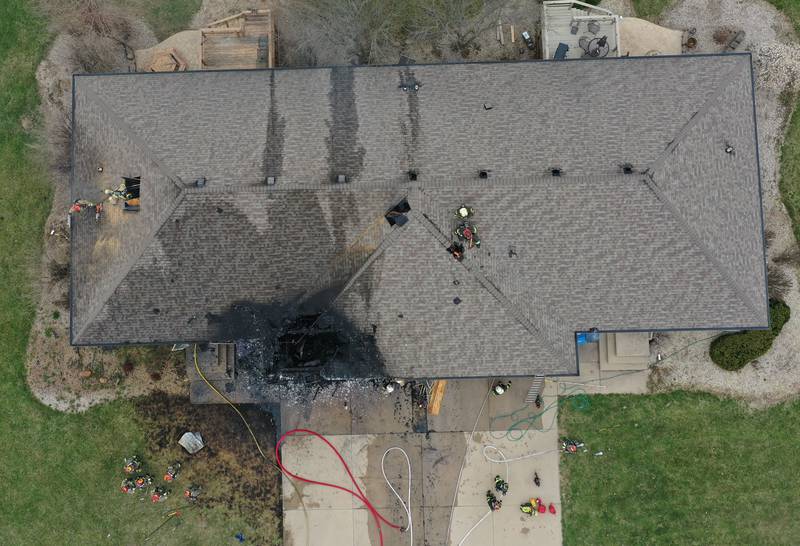 An aerial view of a structure fire in the 600 block of U.S. Route 6 on Tuesday, April 1, 2025 in La Salle. Fire departments from Peru, La Salle, Utica, Troy Grove, Wallace, Spring Valley and Oglesby were dispatched just before 2:30 to a one-story duplex home.