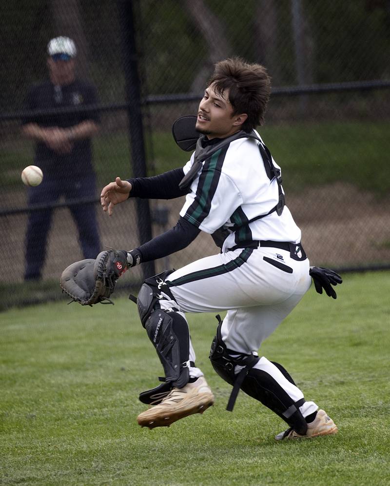 Rock Falls’ Alex Espinoza juggles and is unable to make the catch on a tough pop-up behind home plate against North Boone Tuesday, April 28, 2026.