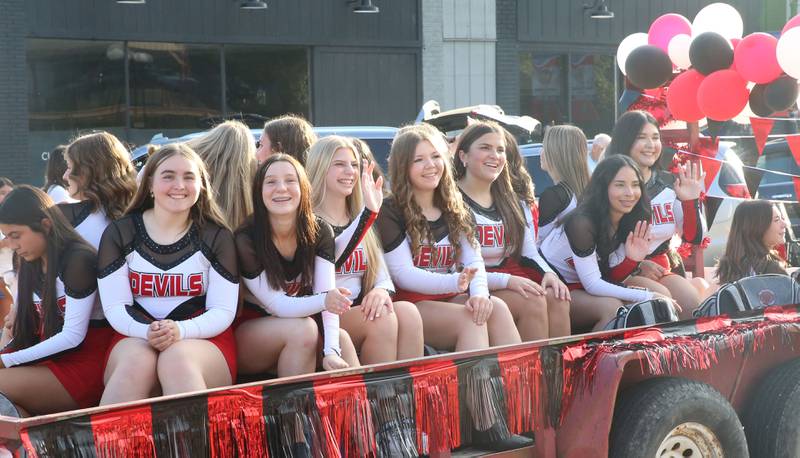 The Hall High School Devilettes ride down East St. Paul Street during the Homecoming parade on Thursday, Sept. 18, 2025 downtown Spring Valley.