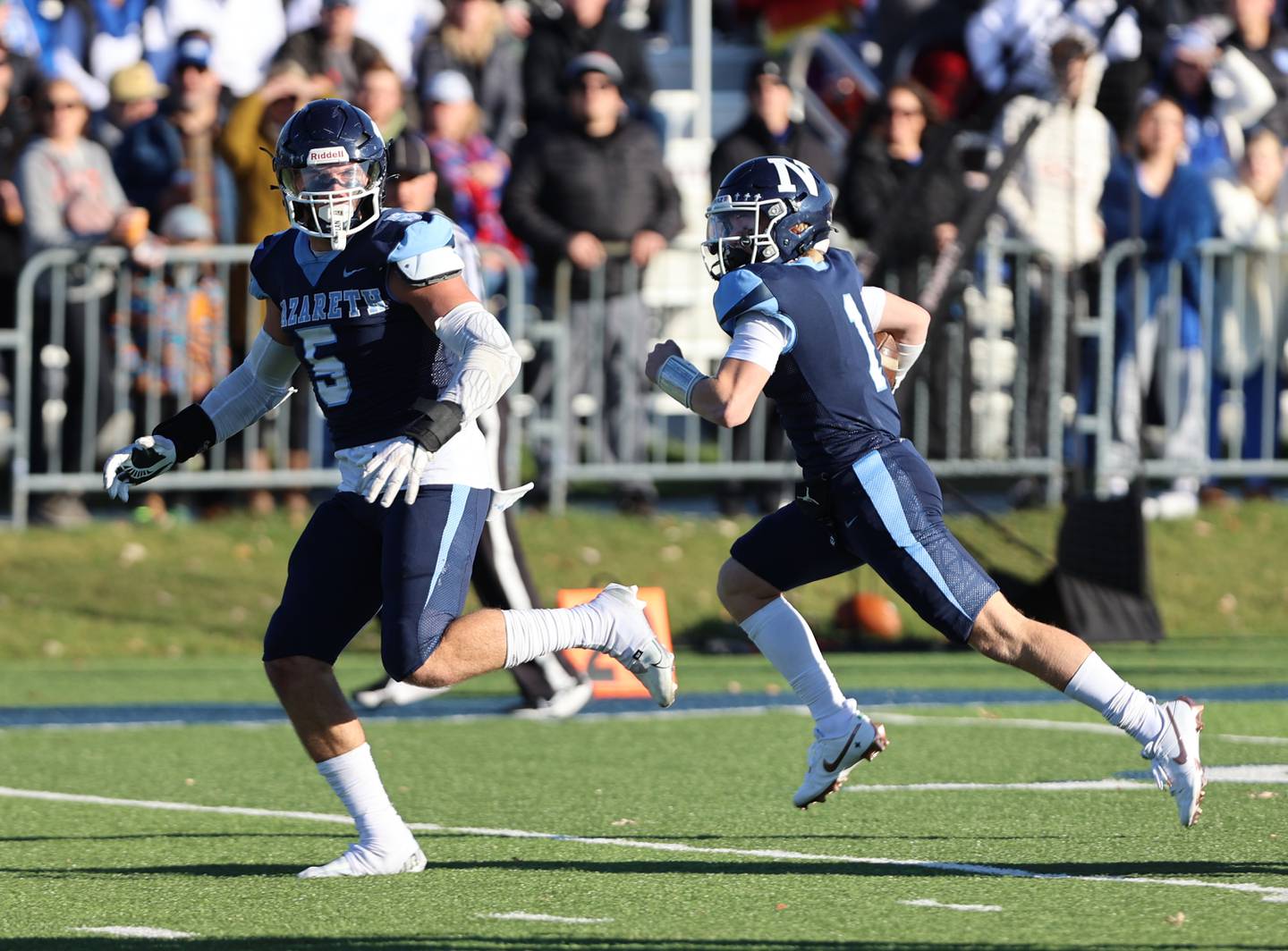 Nazareth's Logan Malachuk (1) runs for a touchdown against St. Francis during the boys varsity IHSA 5A semifinal between Nazareth Academy and St. Francis high school in La Grange Park, IL on Saturday, Nov. 18, 2023.