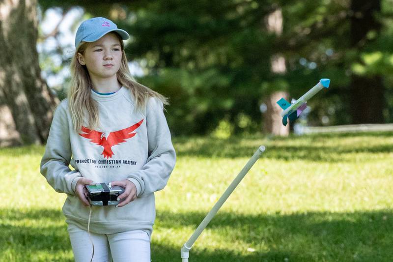 Mia Bullington shoots paper rocket during the 23rd annual Carus Summer Science Camp on Friday, July 18, 2025 at St. Bede High School in Peru.
