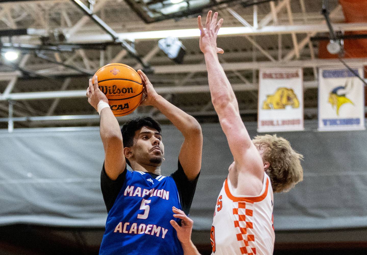 Marmion Academy guard Ali Muhammed Tharwani goes up for a layup during a game against St. Charles East High School on Saturday, Jan. 4, 2025.