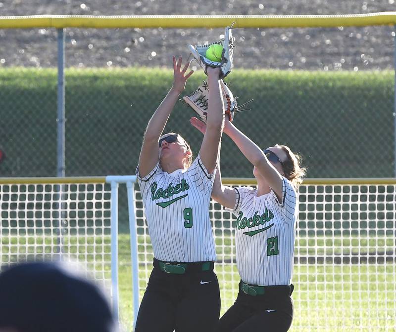 Rock Falls' outfielders Julia Renner (9) and Madisyn Eikenberry (21) reach for a fly ball against Winnebago at the 2A Oregon Regional semifinal on Wednesday, May 20, 2026. The Rockets won the game 7-2 and will play Oregon for the regional championship on Saturday.