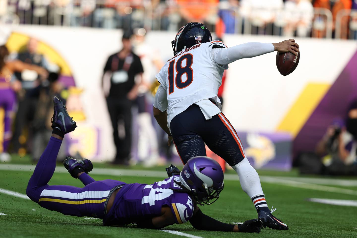 Chicago Bears quarterback Caleb Williams (18) avoids being tackled by Minnesota Vikings safety Jay Ward (24) during the first half of an NFL football game Sunday, Nov. 16, 2025 in Minneapolis. AP Photo/Stacy Bengs)
