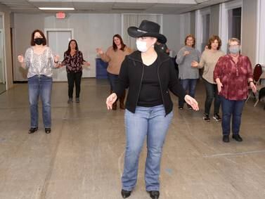 Line dancing brings people together to enjoy music, community