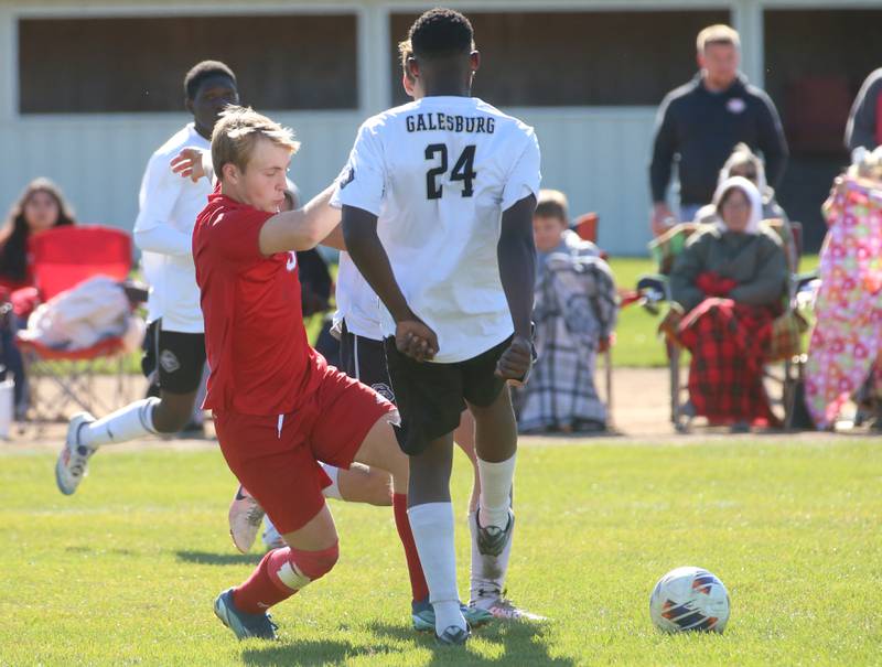 Streator's David Paton knocks the ball past Galesburg's Obed Mbala during the Class 2A Regional final on Saturday, Oct. 26, 2024 at Ottawa High School.