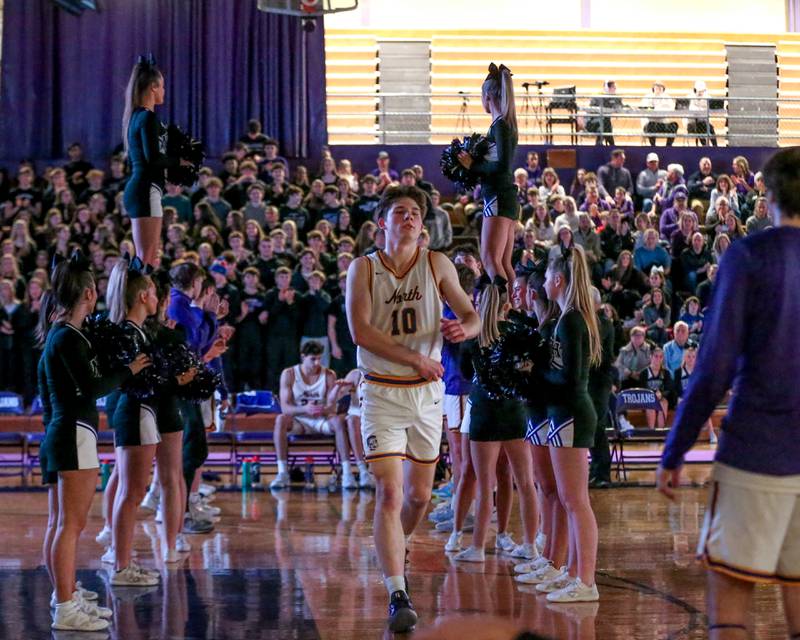 Downers Grove North's Bobby Grganto (10) runs out during pregame introductions before their basketball game between Glenbard West at Downers Grove North. Jan 24, 2025 in Downers Grove.