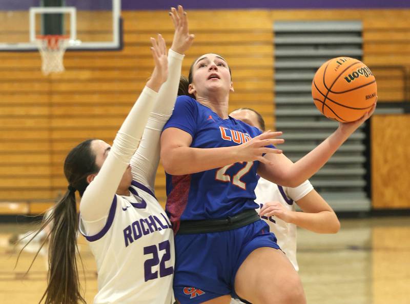 Genoa-Kingston's Regan Creadon goes to the basket against Rochelle's Gianna Olguin during their game Monday, Dec. 15, 2025, at Rochelle High School.