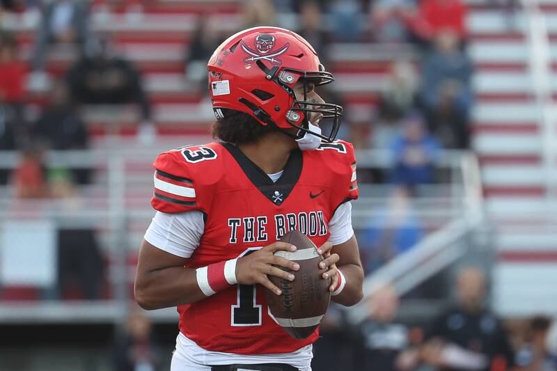 Bolingbrook’s Jonas Williams looks for an open receiver against Naperville North on Friday, Sept. 8, 2023 in Bolingbrook.