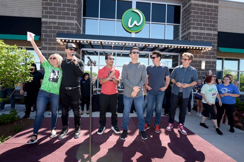 St. Charles Mayor Lora Vitek introduces New Kids on the Block band members Donnie Wahlberg, Danny Wood, Jordan Knight, Jonathan Knight, Joey McIntyre (L-R) during the Wahlk of Fame Ceremony at the Wahlburgers in St. Charles on Saturday, June 18, 2022.