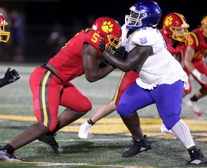 Batavia’s Jordan Buckley (left) goes up against a Phillips player during the season-opener against Phillips in Batavia on Friday, Aug. 25, 2023.