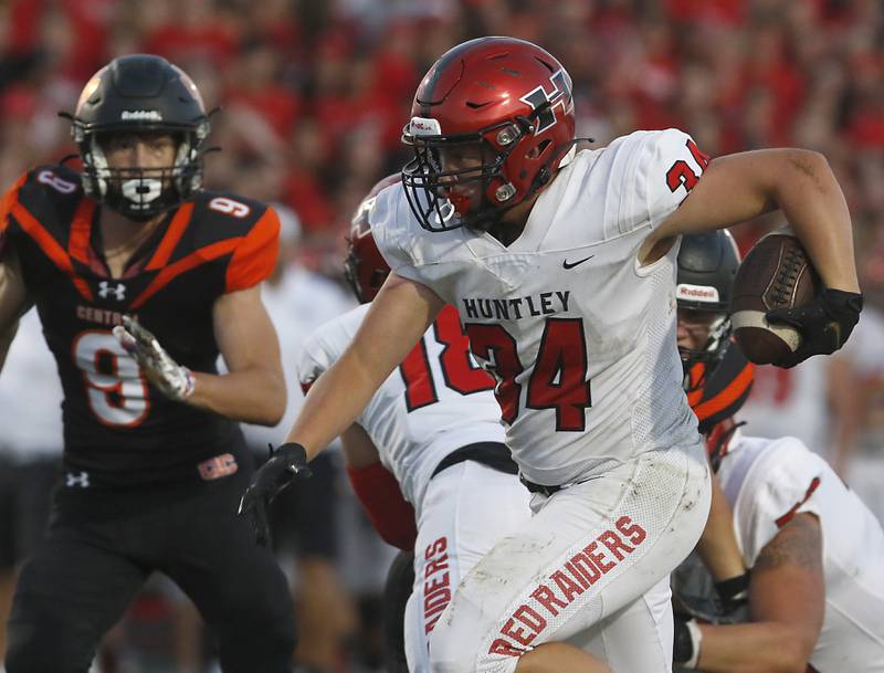 Huntley's Haiden Janke, right, is chased by Crystal Lake Central's Connor Gibour, left, during a Fox Valley Conference football game Friday, Aug. 26, 2022, between Crystal Lake Central and Huntley at Crystal Lake Central High School.