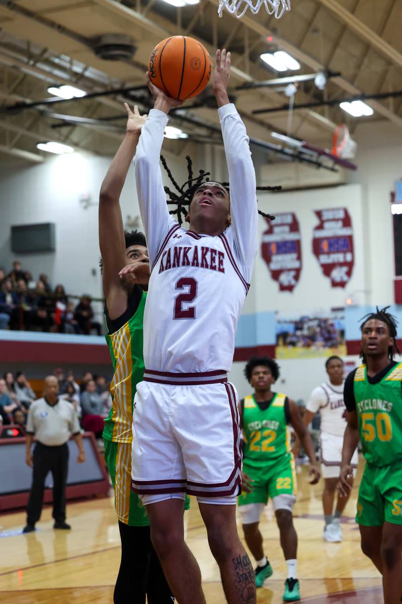 Kankakee's Kenaz Jackson shoots the ball under pressure during the Kays' 83-44 victory over Chicago Ag in the 75th Kankakee Holiday Tournament opening round on Friday, Dec. 26, 2025.