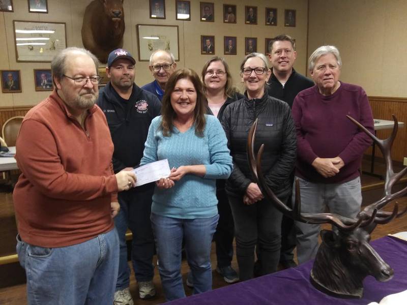 Mary Jo Credi (fourth from left), accepts a $4,00 check from Oglesby Elks Lodge 2360. The donation was funded by the Elks National Foundation Beacon Grant.