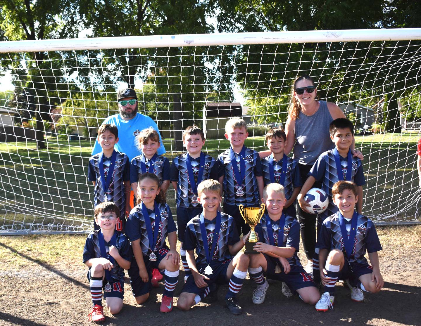 Ottawa Soccer Club's U10 Orange Division city champion was Social Club Barber Shop.