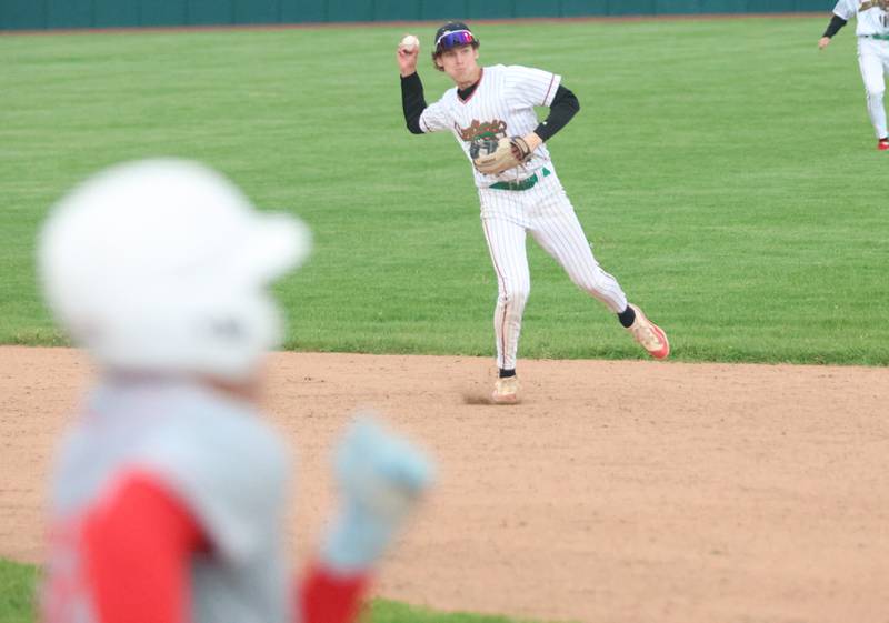 L-P's Grey Ernat throws late to first base as Ottawa's Jack Carroll eyes the bag on Thursday, April 30, 2026 at Huby Sarver Field in the L-P Athletic Complex in La Salle.