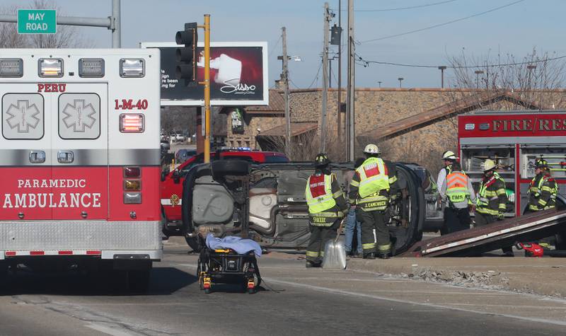 Peru firefighters and paramedics work the scene of a multiple vehicle crash at the intersection of Illinois Route 251 and May Road on Monday, May, 27, 2025 in Peru. The crash happened around 12:45p.m. Ambulances from Peru, La Salle, Mendota Spring Valley, and Oglesby responded to the scene to transport multiple victims to area hospitals. Peru and La Salle police along with Illinois State Police also responded to the crash.