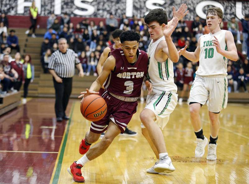 Morton' Jesus Perez (3) dribbles the ball as Morton defeated York 60-55 in a IHSA regional final boys varsity basketball game on Friday March 6, in Cicero, Ill.